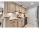 Modern kitchen with updated cabinetry, stainless steel appliances, and granite countertops at 4119 61St Avenue W Ter # 105, Bradenton, FL 34210