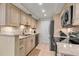 Modern kitchen with updated cabinetry, stainless steel appliances, and granite countertops at 4119 61St Avenue W Ter # 105, Bradenton, FL 34210
