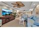 Spacious living room with large TV, comfortable seating, and access to dining area at 4119 61St Avenue W Ter # 105, Bradenton, FL 34210