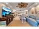 Living room featuring a large TV, comfortable seating, and an open floor plan at 4119 61St Avenue W Ter # 105, Bradenton, FL 34210