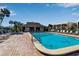 Inviting community pool with ample lounge chairs and a covered area at 4119 61St Avenue W Ter # 105, Bradenton, FL 34210