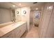 Well-lit bathroom featuring a modern vanity, toilet and glass shower at 4234 Gulf Of Mexico Dr # Y2, Longboat Key, FL 34228