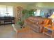Cozy living room with a sofa, coffee table, and a piano, creating a comfortable and inviting space at 4234 Gulf Of Mexico Dr # Y2, Longboat Key, FL 34228