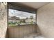 Private balcony overlooking community and parking at 4477 Sandner Dr, Sarasota, FL 34243