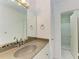Updated bathroom with vanity and marble-look tile shower at 4477 Sandner Dr, Sarasota, FL 34243