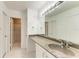 Bathroom with vanity, large mirror and updated shower at 4477 Sandner Dr, Sarasota, FL 34243