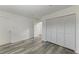 Bright bedroom with wood-look floors and large closet at 4477 Sandner Dr, Sarasota, FL 34243