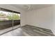 Bright bedroom with wood-look floors and sliding glass door to balcony at 4477 Sandner Dr, Sarasota, FL 34243