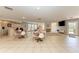 Bright community room with seating area and TV at 4477 Sandner Dr, Sarasota, FL 34243