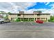 Front view of a townhouse community with parking at 4477 Sandner Dr, Sarasota, FL 34243