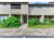 Townhouse entrance with landscaping at 4477 Sandner Dr, Sarasota, FL 34243