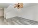 Living room with stairs and ceiling fan at 4477 Sandner Dr, Sarasota, FL 34243