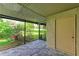 Screened patio with access to backyard at 4477 Sandner Dr, Sarasota, FL 34243