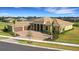 Luxury home with tile roof, three-car garage, and landscaped yard at 4672 Mondrian Ct, Sarasota, FL 34240