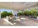 Outdoor patio with comfortable seating and tables at 4672 Mondrian Ct, Sarasota, FL 34240