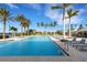Relaxing pool area with plenty of lounge chairs at 4672 Mondrian Ct, Sarasota, FL 34240