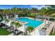 Resort-style pool with lounge chairs and shaded areas at 4672 Mondrian Ct, Sarasota, FL 34240