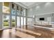 Bright studio with wood floors and a mirrored wall at 4672 Mondrian Ct, Sarasota, FL 34240