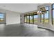 Spacious dining area with large windows and hardwood floors at 4672 Mondrian Ct, Sarasota, FL 34240
