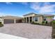 House with a three-car garage and a brick driveway at 4672 Mondrian Ct, Sarasota, FL 34240