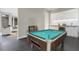 Game room features a pool table and wet bar with granite countertop at 4672 Mondrian Ct, Sarasota, FL 34240