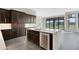 Modern kitchen with dark cabinetry and large island at 4672 Mondrian Ct, Sarasota, FL 34240
