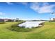 Scenic view of a lake in a residential community at 4672 Mondrian Ct, Sarasota, FL 34240