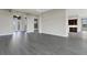 Living room showcasing wood-look floors and access to entry at 4672 Mondrian Ct, Sarasota, FL 34240