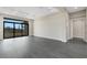 Open living room with sliding glass doors and wood-look floors at 4672 Mondrian Ct, Sarasota, FL 34240