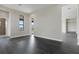 Bright and spacious living room with dark gray vinyl flooring and access to a covered patio at 4672 Mondrian Ct, Sarasota, FL 34240