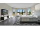Main bedroom with sitting area, large windows, and a neutral color scheme at 4672 Mondrian Ct, Sarasota, FL 34240