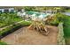 playground with swings and play structures at 4672 Mondrian Ct, Sarasota, FL 34240