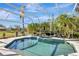 Inviting screened pool with spa and lush landscaping at 4724 White Tail Ln, Sarasota, FL 34238