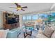 Living room with ocean view and comfortable seating at 6300 Midnight Pass Rd # 606, Sarasota, FL 34242