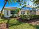 View of the home's back, showcasing the screened-in patio at 6642 Tailfeather Way, Bradenton, FL 34203