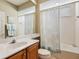 Clean bathroom with tub shower, vanity, and updated fixtures at 6642 Tailfeather Way, Bradenton, FL 34203