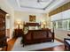 Spacious main bedroom with wood flooring and a large window at 6642 Tailfeather Way, Bradenton, FL 34203