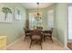 A breakfast nook with wicker chairs and a glass-top table at 6642 Tailfeather Way, Bradenton, FL 34203