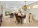 Elegant dining room with a large table and chandelier at 6642 Tailfeather Way, Bradenton, FL 34203