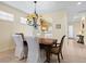 Dining room with a view of the kitchen and entryway at 6642 Tailfeather Way, Bradenton, FL 34203