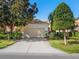 Inviting exterior with a single car garage and manicured landscaping at 6642 Tailfeather Way, Bradenton, FL 34203