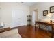 Bright office features hardwood floors, built-in shelving and a desk at 6642 Tailfeather Way, Bradenton, FL 34203