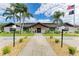 Community clubhouse with manicured lawn at 7135 27Th W Ave # 7135, Bradenton, FL 34209