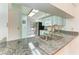 Modern kitchen sink with granite countertop and brushed nickel faucet at 7135 27Th W Ave # 7135, Bradenton, FL 34209