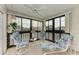 Bright sunroom with seating and ceiling fan at 7135 27Th W Ave # 7135, Bradenton, FL 34209