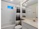 Clean bathroom with shower/tub combo, vanity, and window at 7335 Fountain Palm Cir # 7335, Bradenton, FL 34203