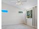 Spacious bedroom with ceiling fan, multiple windows and carpet flooring at 7335 Fountain Palm Cir # 7335, Bradenton, FL 34203