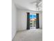 Bedroom with sliding glass doors leading to balcony at 7335 Fountain Palm Cir # 7335, Bradenton, FL 34203