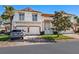 Two-story home with a two-car garage, balcony, and landscaped yard at 7335 Fountain Palm Cir # 7335, Bradenton, FL 34203