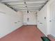 Attached garage with light colored walls and floor, and an automatic garage door at 7335 Fountain Palm Cir # 7335, Bradenton, FL 34203